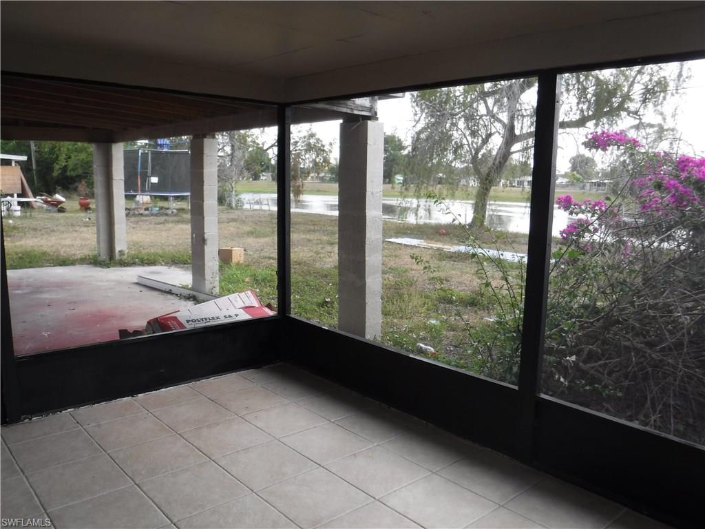 106 Oleander Road Lehigh Acres, FL 33936 - Photo 7 of 17 a living room with a large window