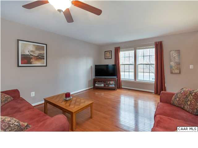 602 Rainier Road Charlottesville, VA 22903 - Photo 3 of 18 a living room with furniture and a flat screen tv