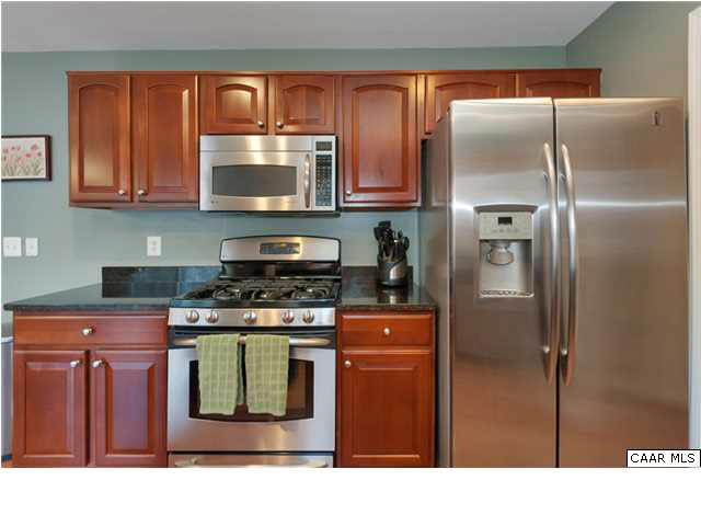 602 Rainier Road Charlottesville, VA 22903 - Photo 8 of 18 a kitchen with stainless steel appliances granite countertop a refrigerator a stove and a sink