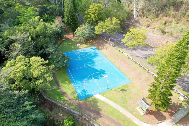 a view of a swimming pool with a yard