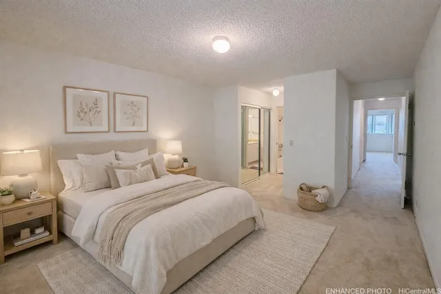 a bedroom with a bed and a view of bedroom