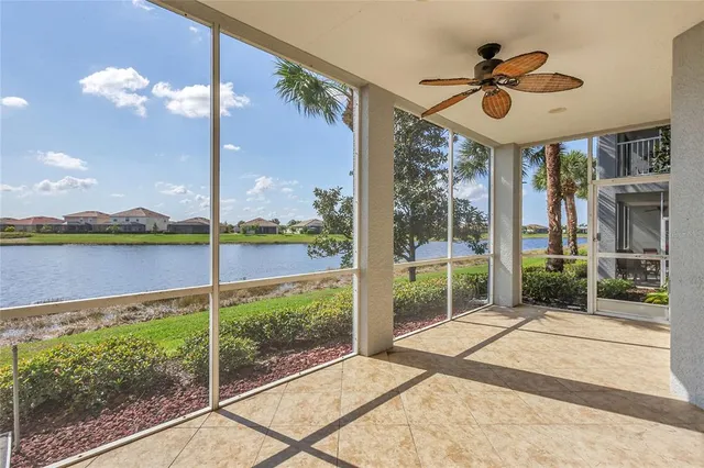 an aerial view of a house with a lake view