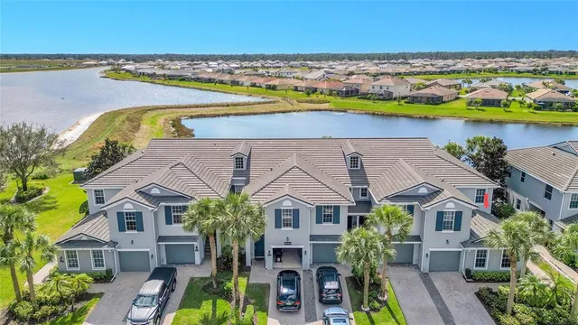 an aerial view of a house with a swimming pool yard and outdoor seating