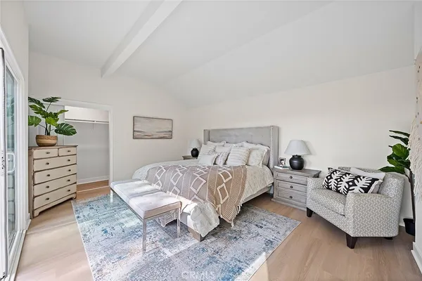 a bedroom with a bed and a couch