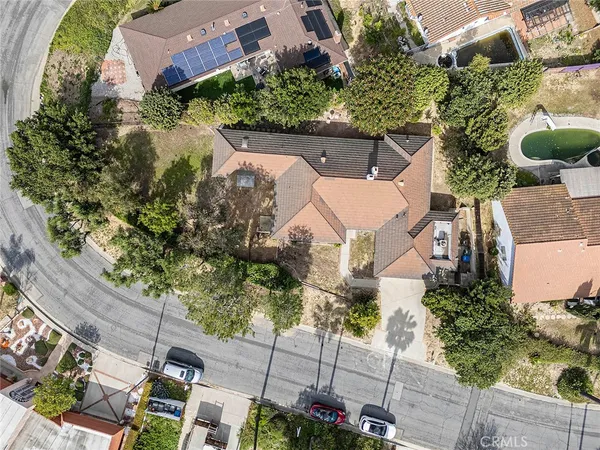 an aerial view of a house with a garden