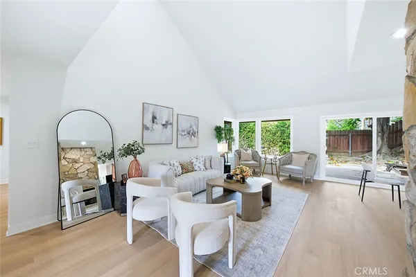 a living room with furniture or couch and a large window