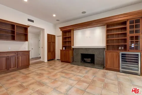 a view of a livingroom with an empty space and fire place