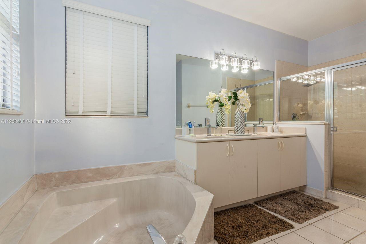 2240 Northeast 37th Terrace Homestead, FL 33033 - Photo 12 of 18 a bathroom with a sink and a mirror