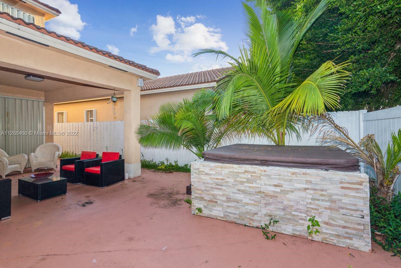 2240 Northeast 37th Terrace Homestead, FL 33033 - Photo 16 of 18 a view of yard with car parked