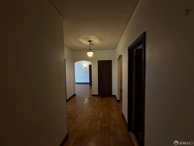 a view of a hallway with a room