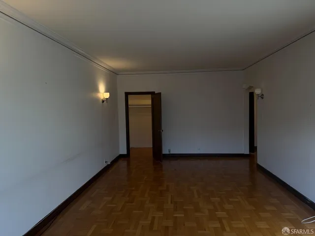 a view of a room with a hallway