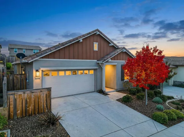 a front view of a house with a garage