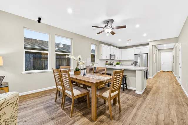 a view of a dining room with furniture window and wooden floor
