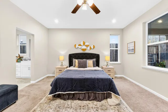 a spacious bathroom with a sink and a mirror