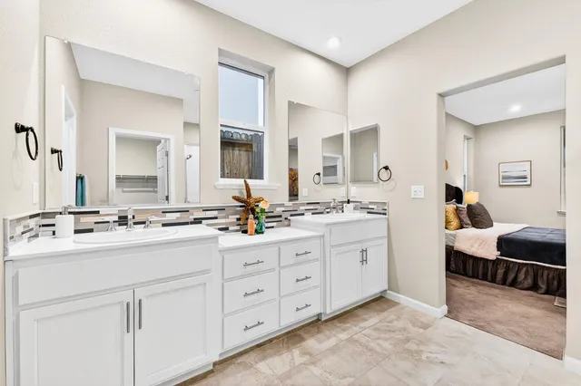 a bathroom with a shower and a glass door
