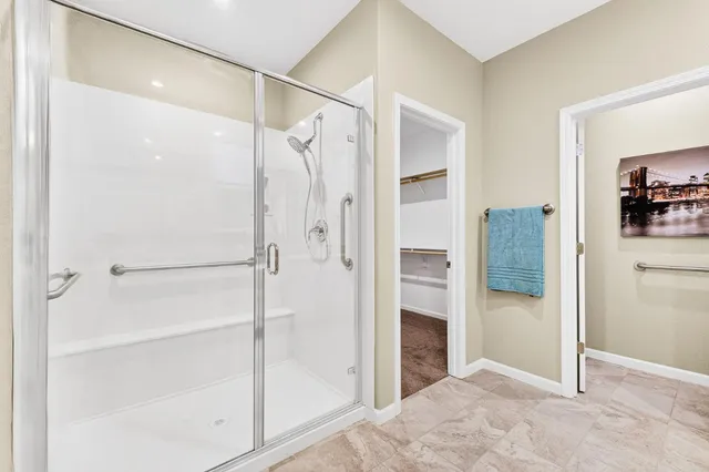 a view of walk in closet with empty racks