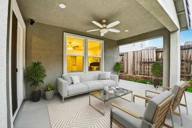 a front view of a house with yard and green space