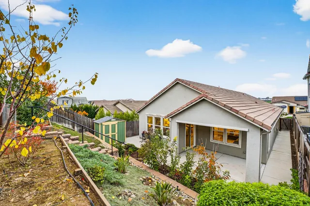 a view of multiple houses with a street