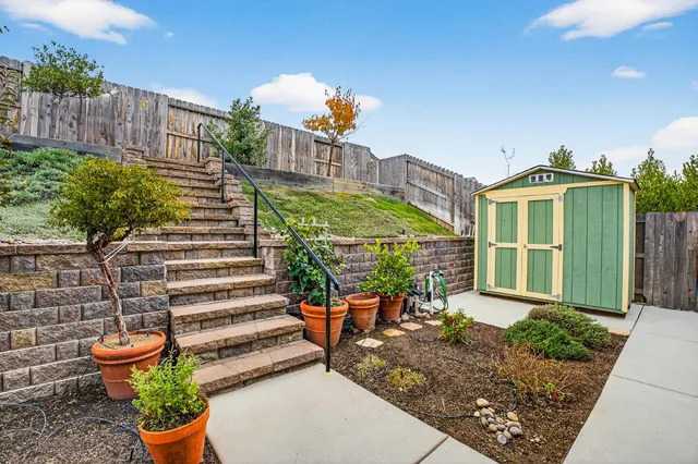 a view of multiple houses with a street