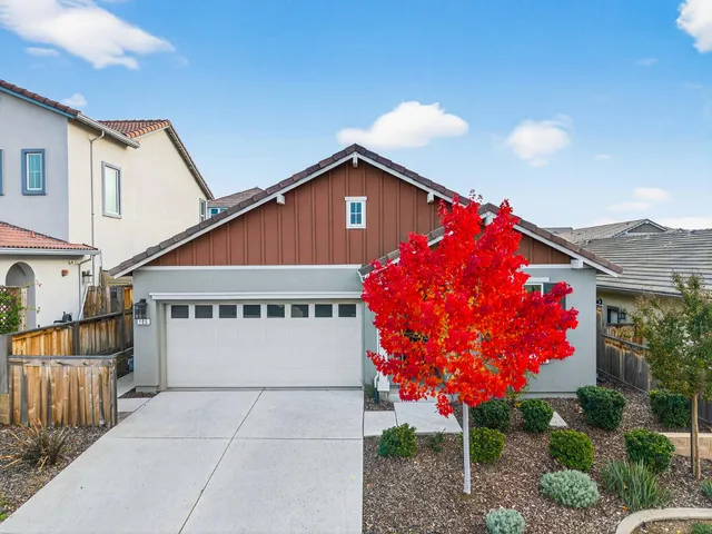 an aerial view of a house with outdoor space and lake view