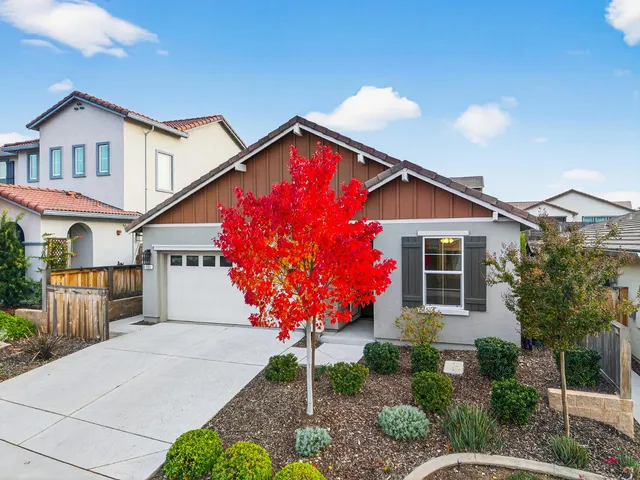 a aerial view of multi story residential apartment building with yard
