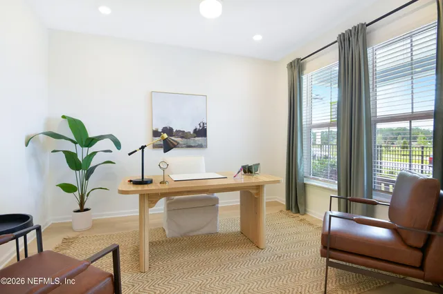 a view of a room with furniture and a potted plant