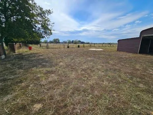 a view of a yard with an outdoor seating