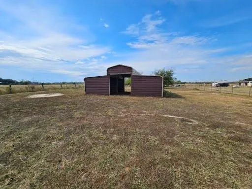 a view of a lake with a building in the background