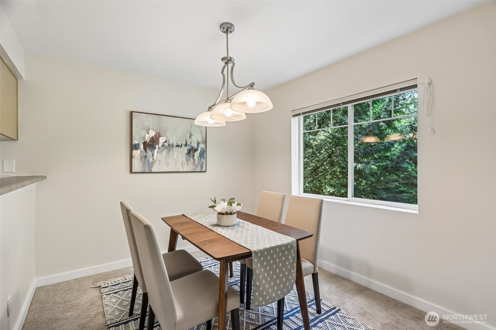 18930 Bothell Everett Highway, Unit E301 Bothell, WA 98012 - Photo 7 of 28 a dining room with furniture and window