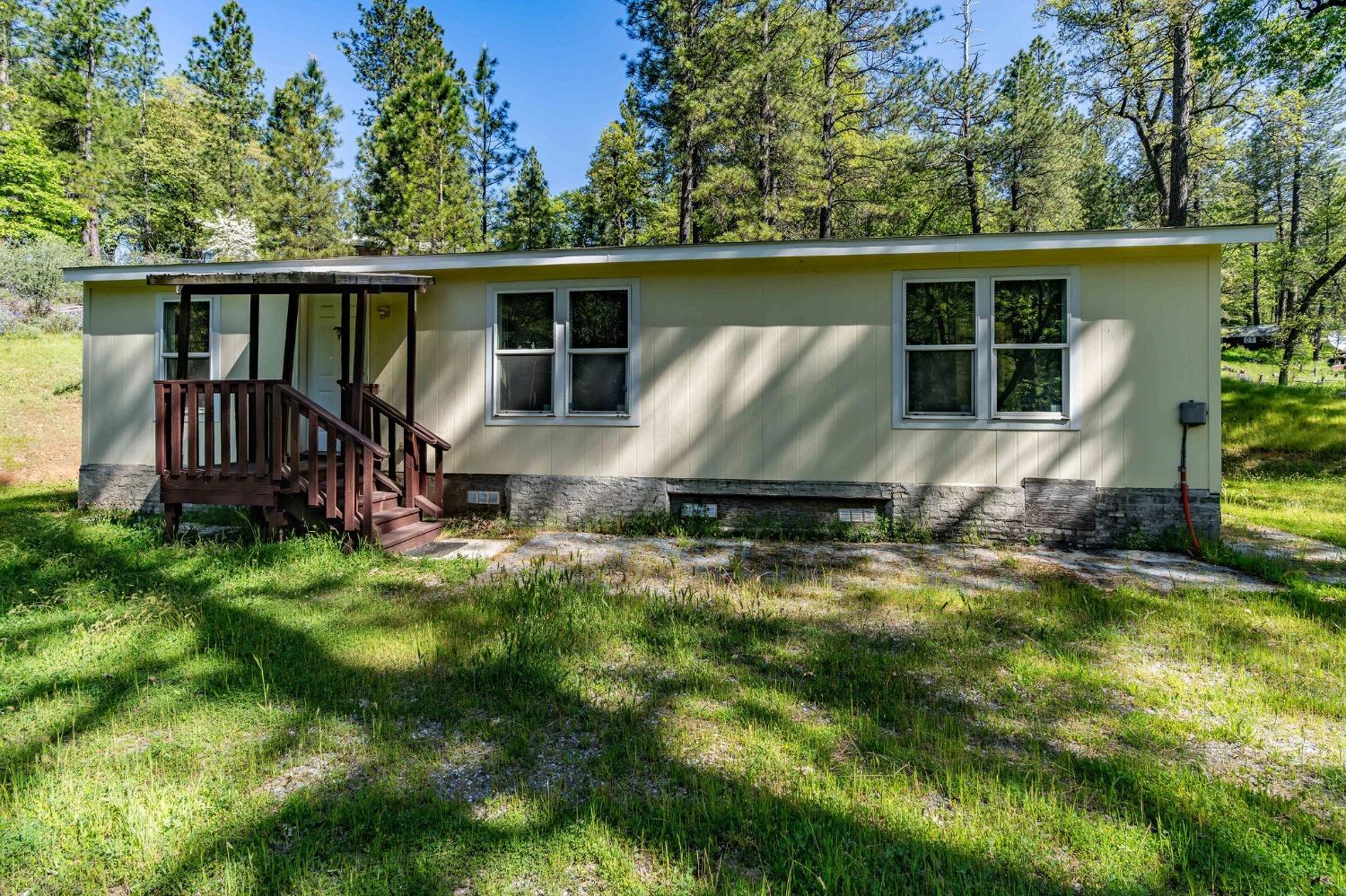 121 Rabbit's Foot Road West Point, CA 95255 - Photo 1 of 1 a view of a backyard with a small cabin