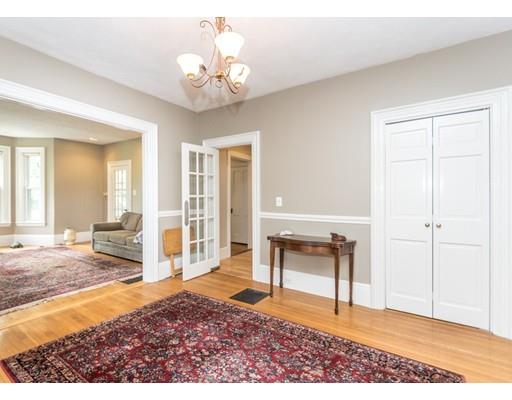 19 Forest Street Newton, MA 02461 - Photo 11 of 33 a view of a livingroom with wooden floor and a chandelier