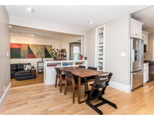 19 Forest Street Newton, MA 02461 - Photo 17 of 33 a view of a dining room with furniture a chandelier and wooden floor