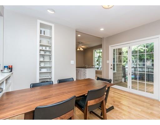 19 Forest Street Newton, MA 02461 - Photo 18 of 33 a dining room with a wooden table and chairs