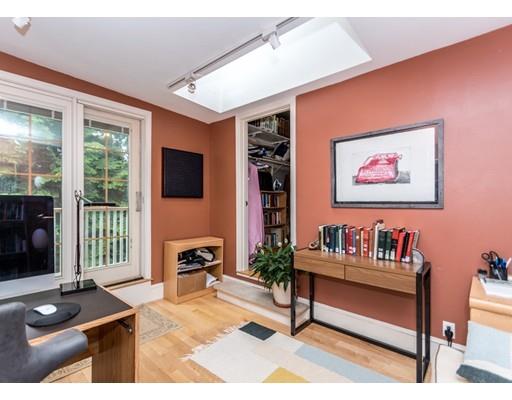19 Forest Street Newton, MA 02461 - Photo 23 of 33 a living room with furniture a flat screen tv and a window