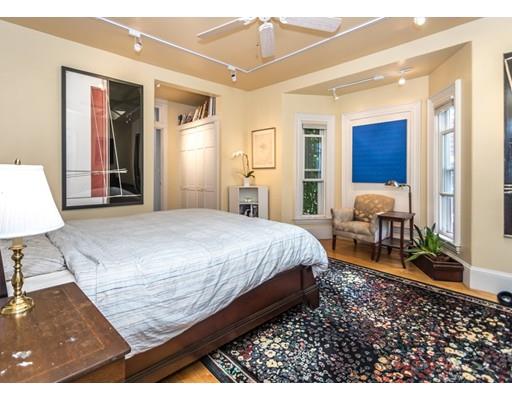 19 Forest Street Newton, MA 02461 - Photo 24 of 33 a bed room with a bed and a chair