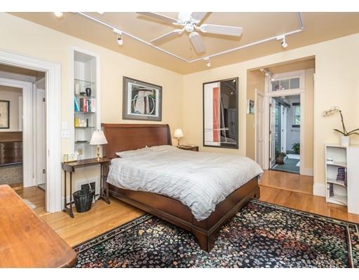 19 Forest Street Newton, MA 02461 - Photo 25 of 33 a bedroom with a bed lamps and a view of living room