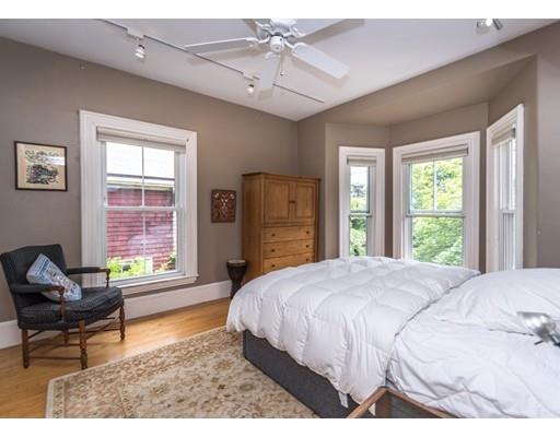 19 Forest Street Newton, MA 02461 - Photo 26 of 33 a spacious bedroom with a bed and a window