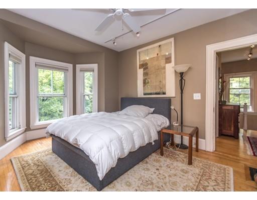 19 Forest Street Newton, MA 02461 - Photo 27 of 33 a bed sitting in a bedroom next to a window