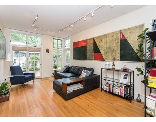 19 Forest Street Newton, MA 02461 - Photo 6 of 33 a living room with furniture and a flat screen tv