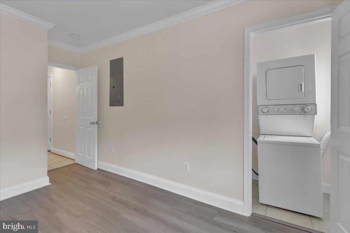 1707 Capitol Avenue Northeast, Unit 3 Washington, DC 20002 - Photo 4 of 11 a view of an empty room with wooden floor and closet