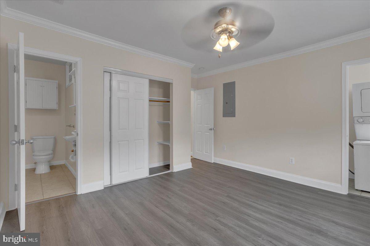 1707 Capitol Avenue Northeast, Unit 3 Washington, DC 20002 - Photo 5 of 11 wooden floor in an empty room with a bathroom
