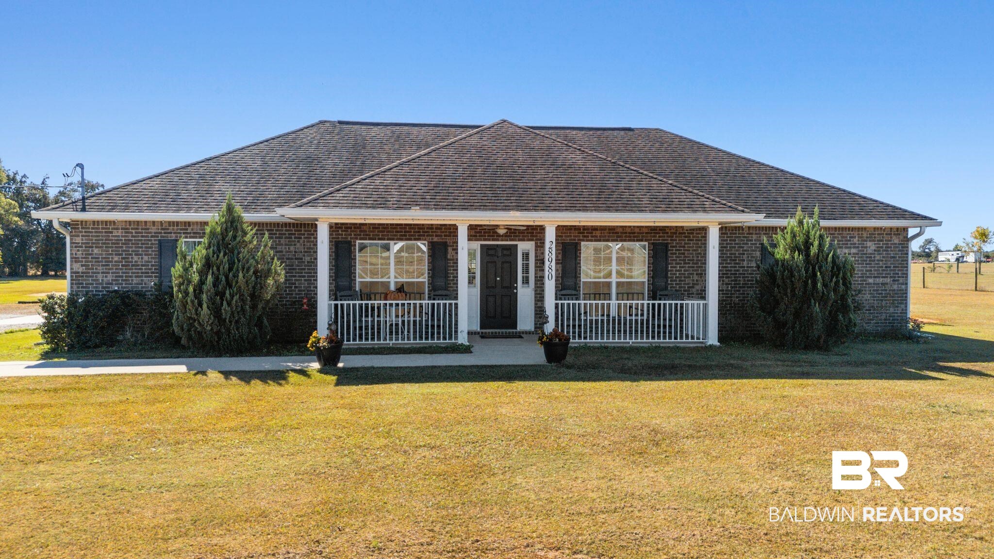 28980 Comstock Road Elberta, AL 36530 - Photo 1 of 38 Single story home with a front lawn, a porch, and brick siding