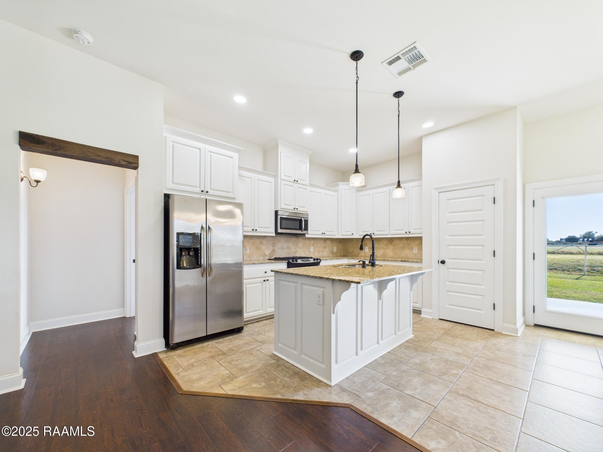 204 Whispering Meadows Road Broussard, LA 70518 - Photo 9 of 24 Living + Kitchen + Dining
