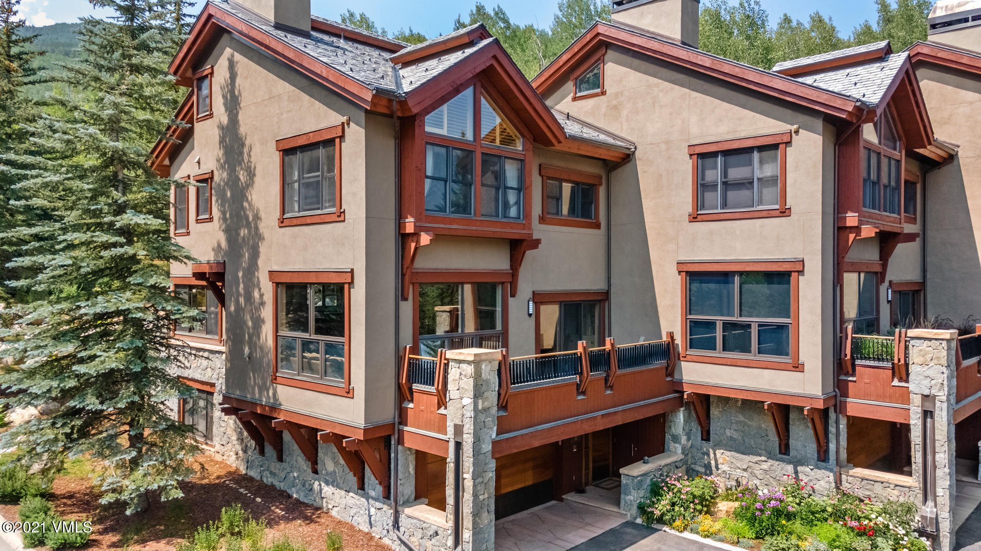 40 Elk Track Road, Unit 1 Beaver Creek, CO 81620 - Photo 1 of 31 a view of residential houses with deck and furniture