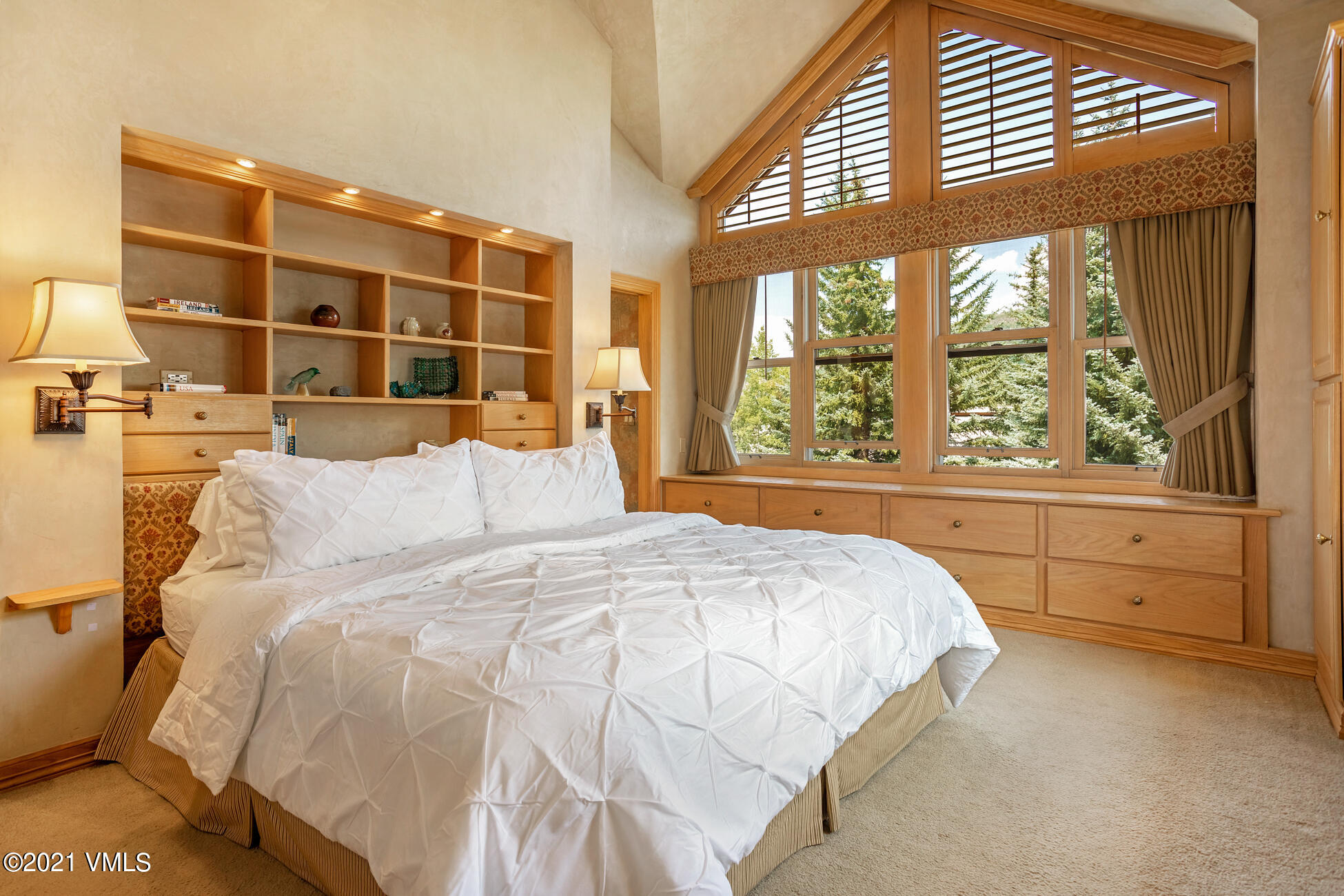 40 Elk Track Road, Unit 1 Beaver Creek, CO 81620 - Photo 14 of 31 a large bed sitting in a bedroom next to a window