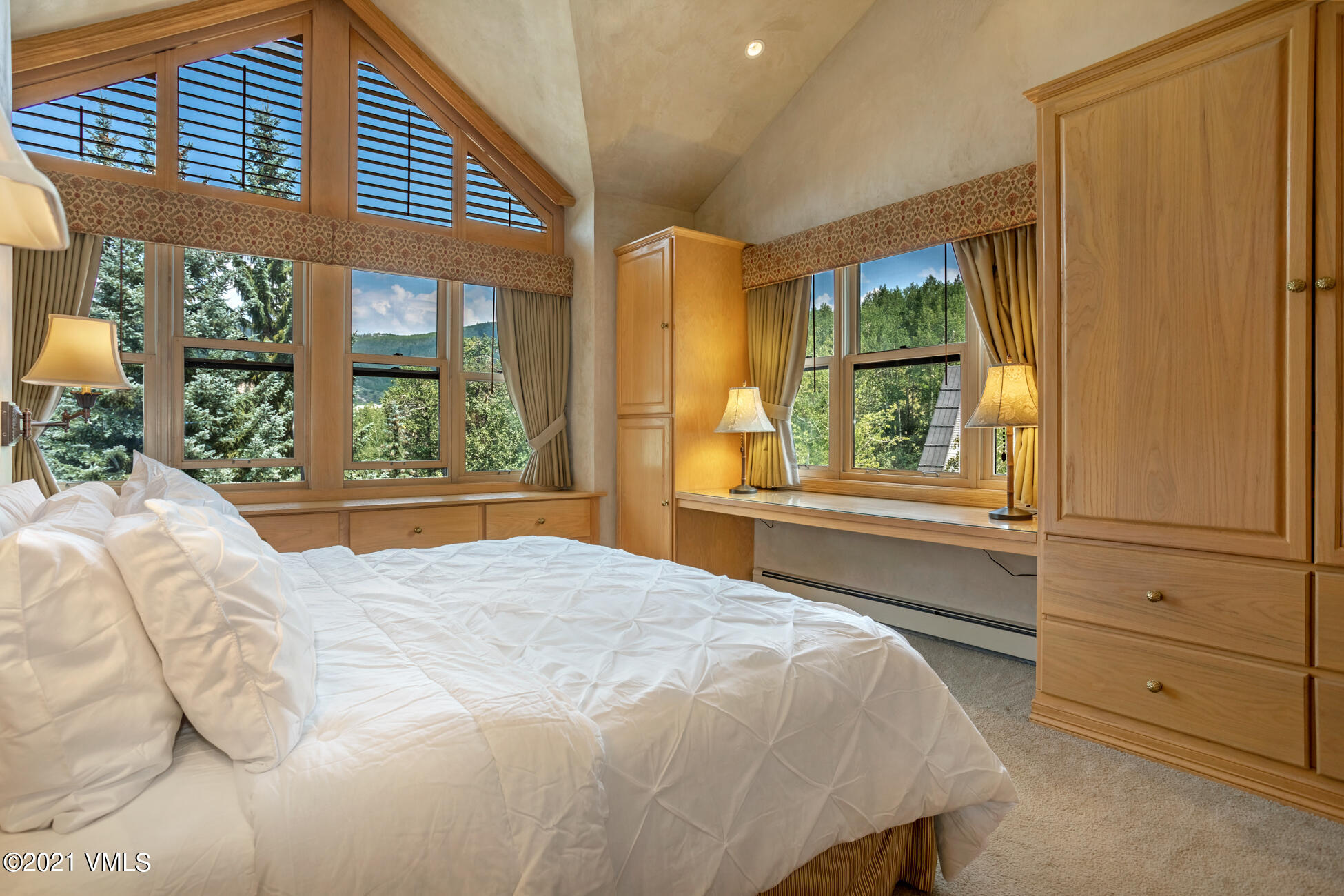 40 Elk Track Road, Unit 1 Beaver Creek, CO 81620 - Photo 15 of 31 a bedroom with a bed and a large window