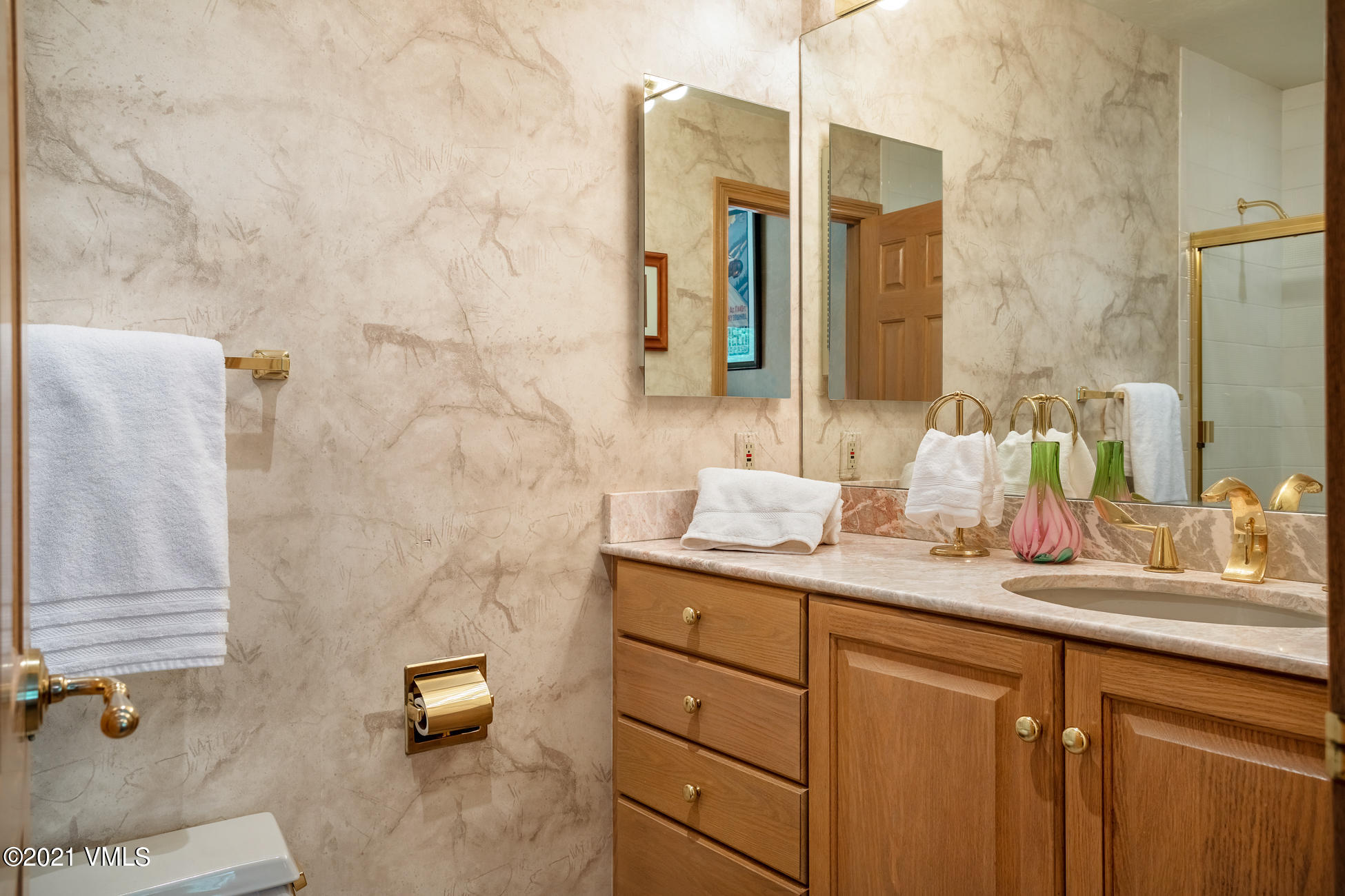 40 Elk Track Road, Unit 1 Beaver Creek, CO 81620 - Photo 19 of 31 a bathroom with a granite countertop sink and a mirror