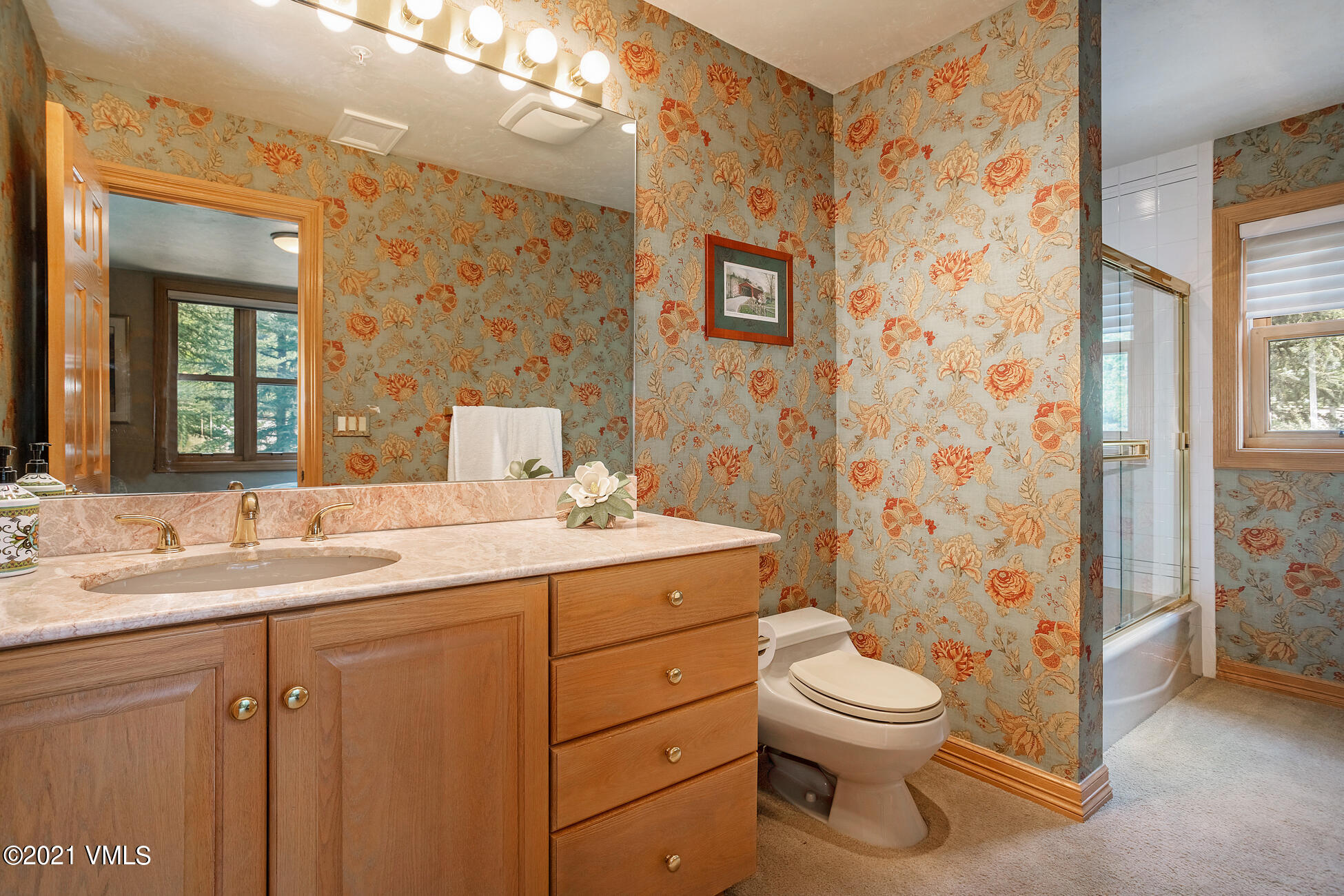 40 Elk Track Road, Unit 1 Beaver Creek, CO 81620 - Photo 22 of 31 a bathroom with a granite countertop sink toilet a mirror a vanity and shower