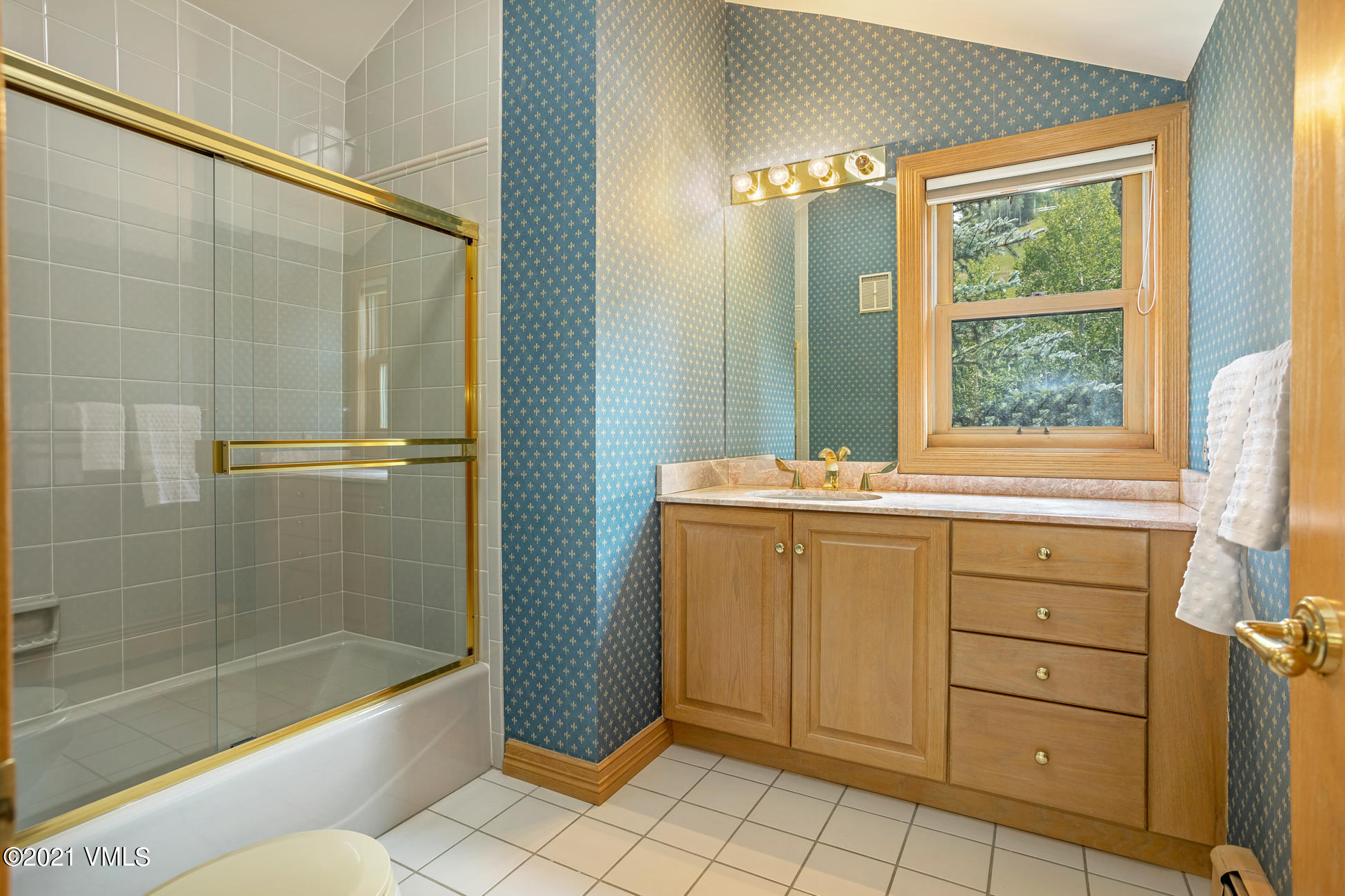 40 Elk Track Road, Unit 1 Beaver Creek, CO 81620 - Photo 27 of 31 a bathroom with a granite countertop sink a mirror and a bathtub