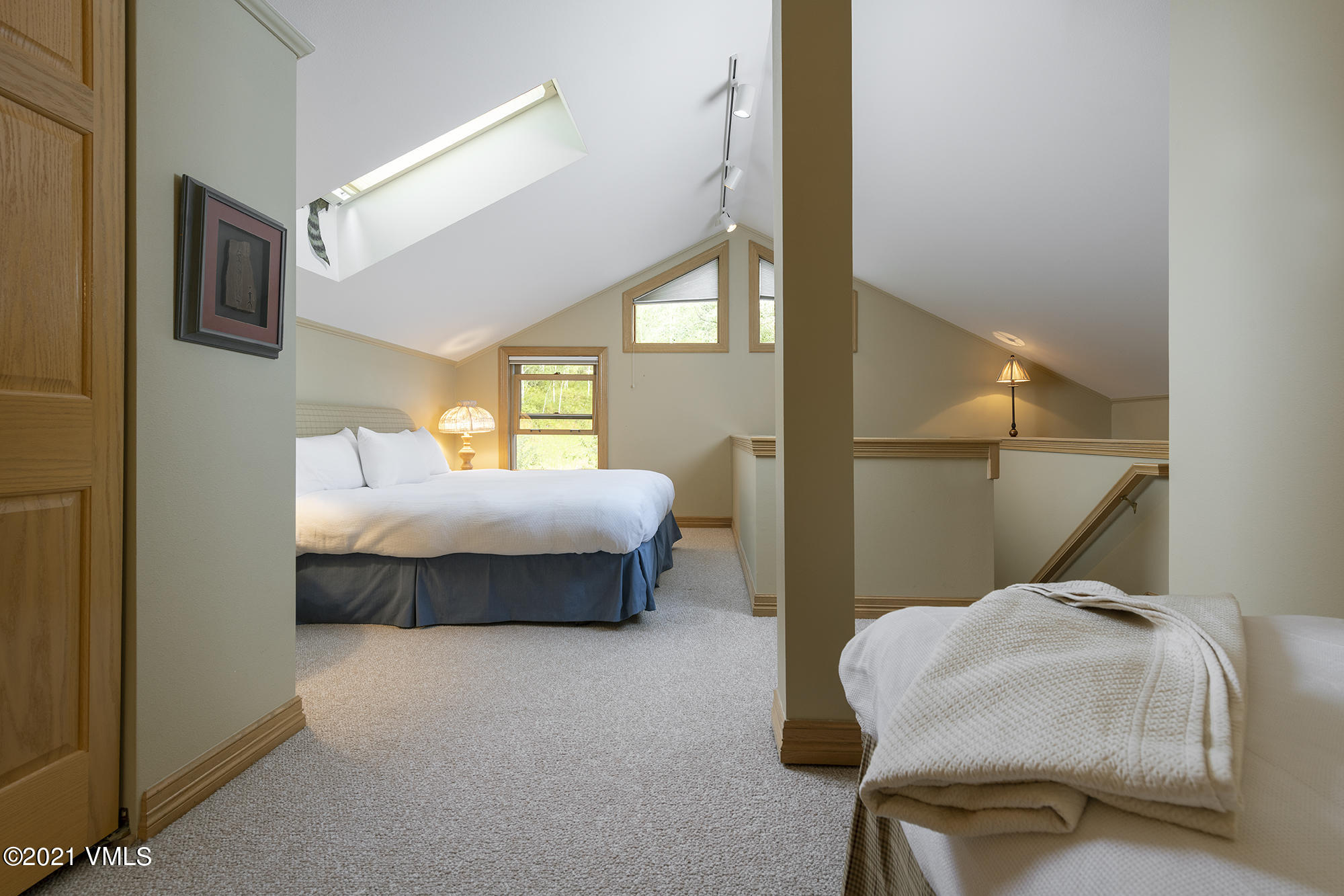 40 Elk Track Road, Unit 1 Beaver Creek, CO 81620 - Photo 28 of 31 a spacious bedroom with a bed and a large mirror
